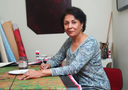 Lubna Agha painting a canvas c. 2010